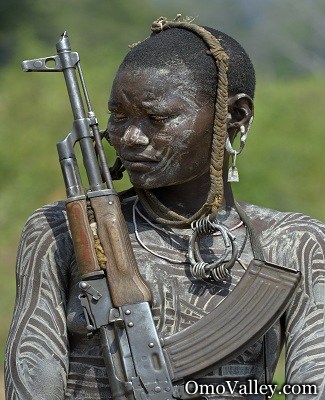 A member of the Mursi tribe with an AK 47 rifle